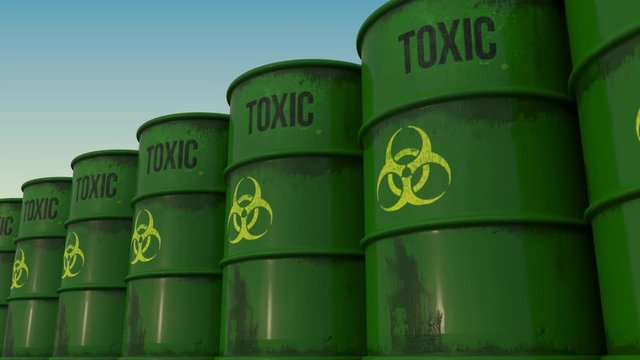 Line of green barrels with biohazard content. 4K seamless loopable animation, ProRes