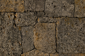 Texture of wall making from beautiful volcano rock in Jeju Island, South Korea