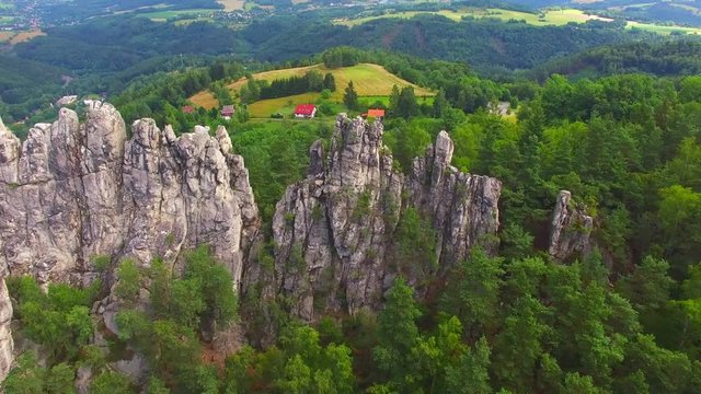 Camera flight over mountain range. Video from drone. National park Cesky Raj near Prague in Czech Republic. Amazing places in Central Europe. Destination for hiking, mountaineering and climbing.