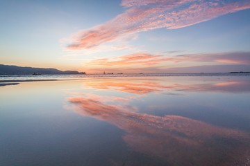 Reflection Sunrise or Sunset View With Orange Cloud and Blue Sky