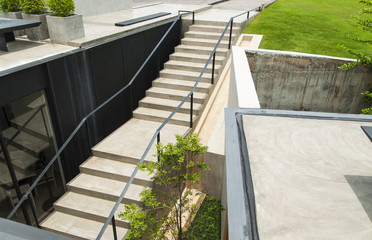 Top view of concrete stairs with garden