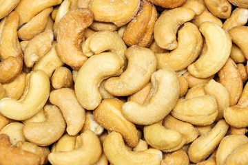 Cashew nuts on the black background.