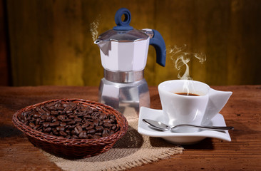 Coffee pot and cup with aromatic coffee