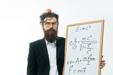 bearded man with einstein formula and newtons law