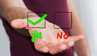 Young man voting yes to a referendum