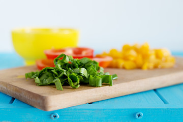 Ingredients for salad on cutting board. Selective focus