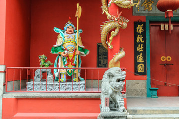 lion and warrior in the entry of a Chinese temple in kuala lumpur, Malaysia