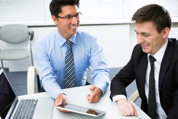 Young businessmen working in office.