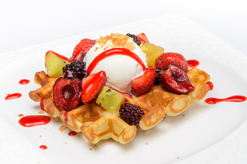 Dessert with berries and ice cream