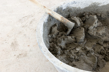 building construction wall. mix cement plaster concrete in  bucket