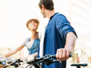 Happy couple in city with bike