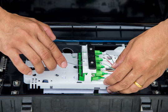 Technicians are installing optic fiber.