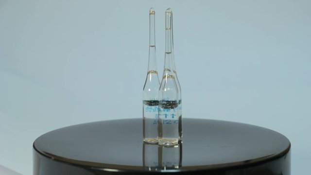 Ampoules rotate on a white background 4