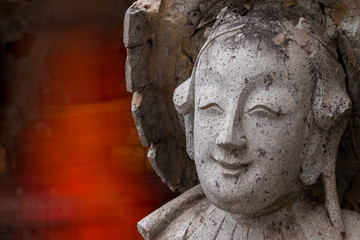 Fototapeta na wymiar Close-ups statue the face Chinese Stone Doll.