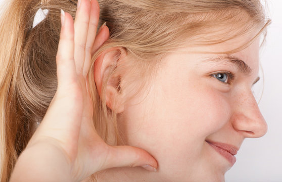 Young woman listening a quiet noise