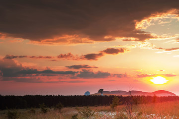 radio telescopes at sunset