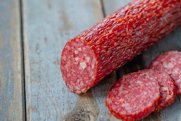 Salami sausage on the rustic table