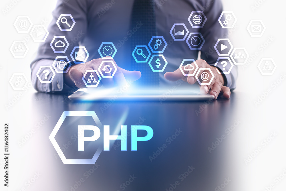 Wall mural businessman is using tablet pc and selecting php icon.