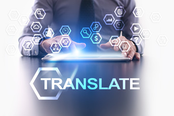 Businessman is using tablet pc and selecting Translate icon.