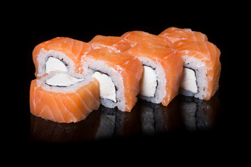 Japanese rolls on black background
