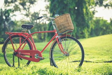 Fototapeta na wymiar Red Japan style classic bicycle at the park