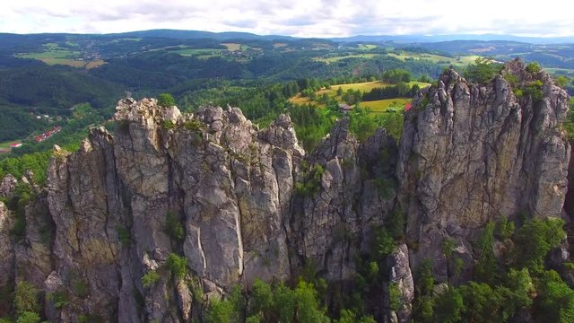 Camera flight over mountain range. Video from drone. National park Cesky Raj near Prague in Czech Republic. Amazing places in Central Europe. Destination for hiking, mountaineering and climbing.