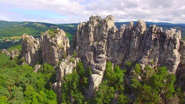 Camera flight over mountain range. Video from drone. National park Cesky Raj near Prague in Czech Republic. Amazing places in Central Europe. Destination for hiking, mountaineering and climbing.