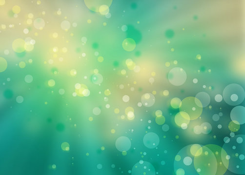 pretty bokeh background with sunbeam or rays shining through round circle shapes floating in bright blue green sky