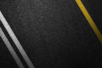 Level asphalted road with a dividing white and yellow stripes. The texture of the tarmac, top view.