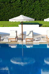 Sunbeds and umbrellas near the pool