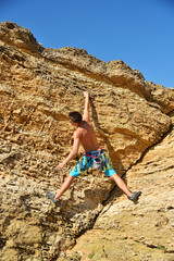 man climbing on Mountain