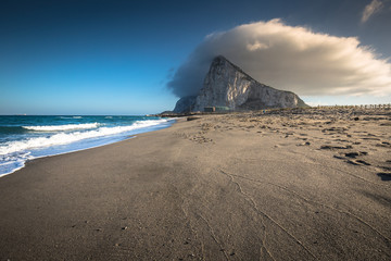 The Rock of Gibraltar from the beach of La Linea, Spain - obrazy, fototapety, plakaty