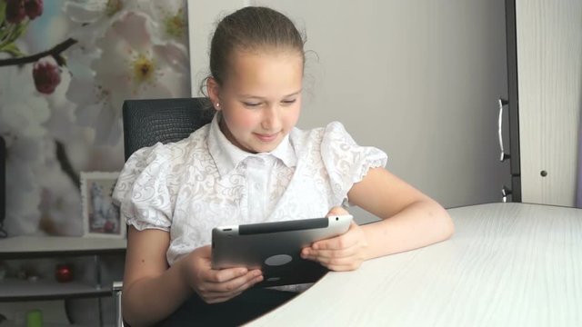 Little girl holding a digital tablet computer