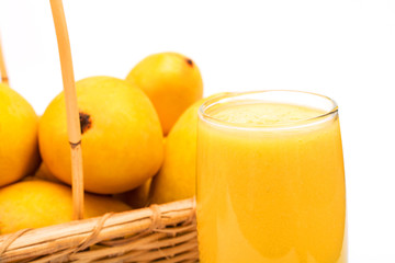 Mango juice with fresh fruit over white background