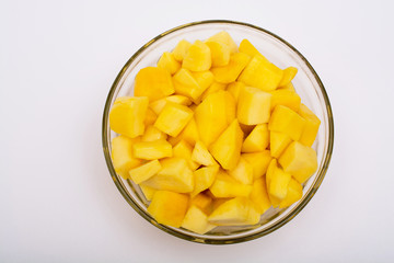 Fresh and juicy slice of mango in bowl