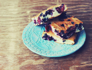 blueberry pie on beautiful blue plate