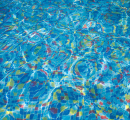 The bottom of the pool of multicolored tiles