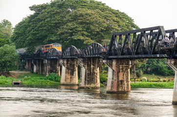 Fototapeta premium Trains for travel running on the old bridge over the River Kwai Yai is a historical attractions during World War 2 the famous of Kanchanaburi Province in Thailand