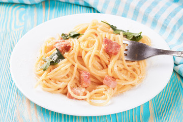 Pasta Carbonara in white plate.