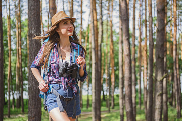 Attractive female tourist enjoying nature