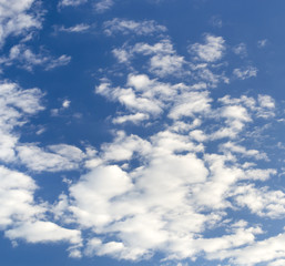 blue sky background with tiny clouds