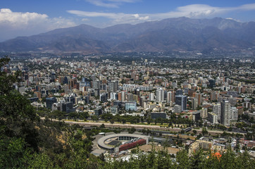 Fototapeta na wymiar Aerial view of a city and The Andes mountain in the background, Santiago, Chile