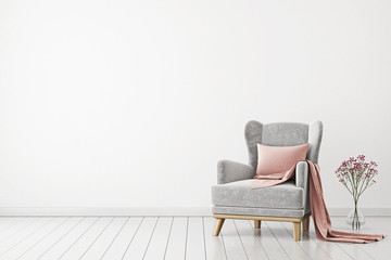 Neutral interior with velvet armchair on empty white wall background. 3D rendering.