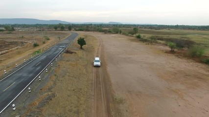 suv car driving on country road