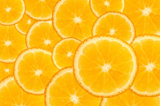Fresh plie of top view slice juicy citrus oranges show detail in