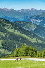 Fototapeta na wymiar Tourists climbing in Alps