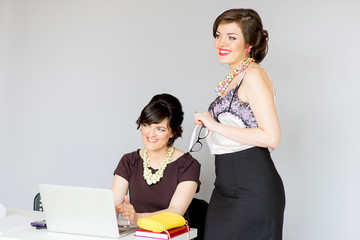 two girl in a business suit and glasses