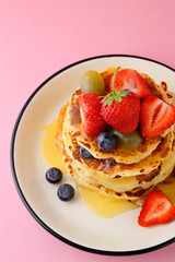 pancakes with summer berries on plate