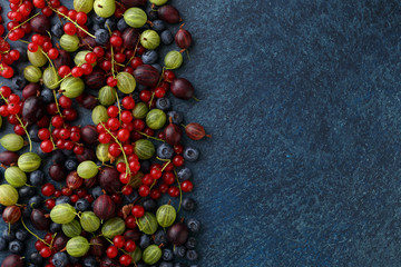Fresh summer berries on stone background