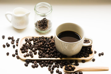 Cup Of Espresso / Cup Of Espresso And Roasted Coffee Beans Scattered In Wooden Plate On White Background.